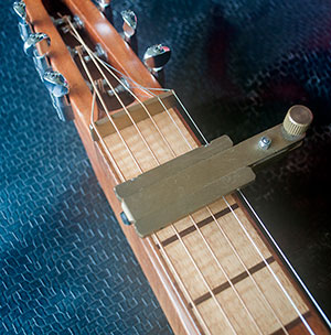 top view of GM capo fitted to guitar