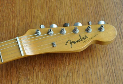Closeup of headstock and logo